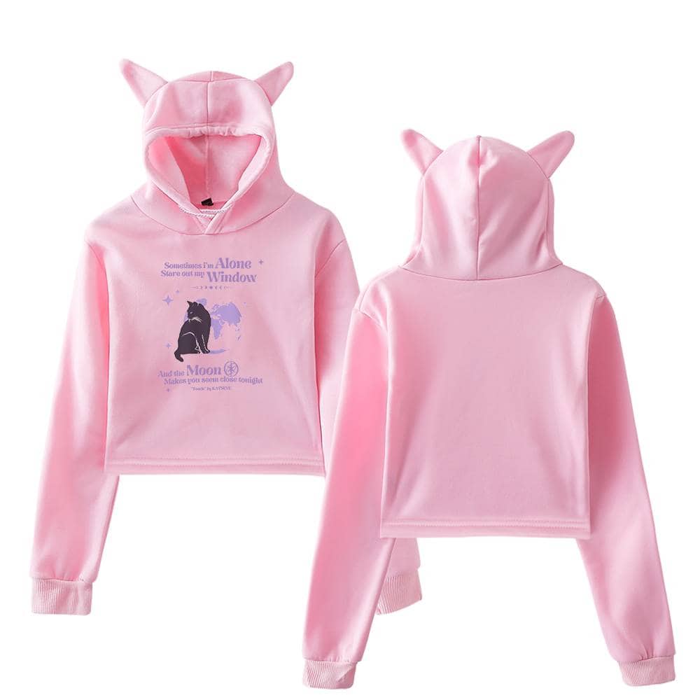 Pink hooded sweatshirt with cat ears and graphic text inspired by Justin Bieber swag merchandise, featuring a playful and trendy design.