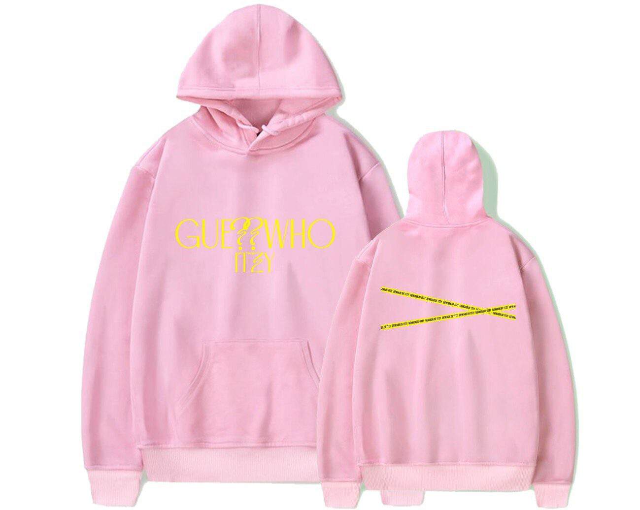 Genuine pink hoodie featuring bold yellow "GUESS WHO" text on the front and diagonal yellow "OFF-WHITE" style tape detailing on the back, embodying trendy Justin Bieber swag merch.