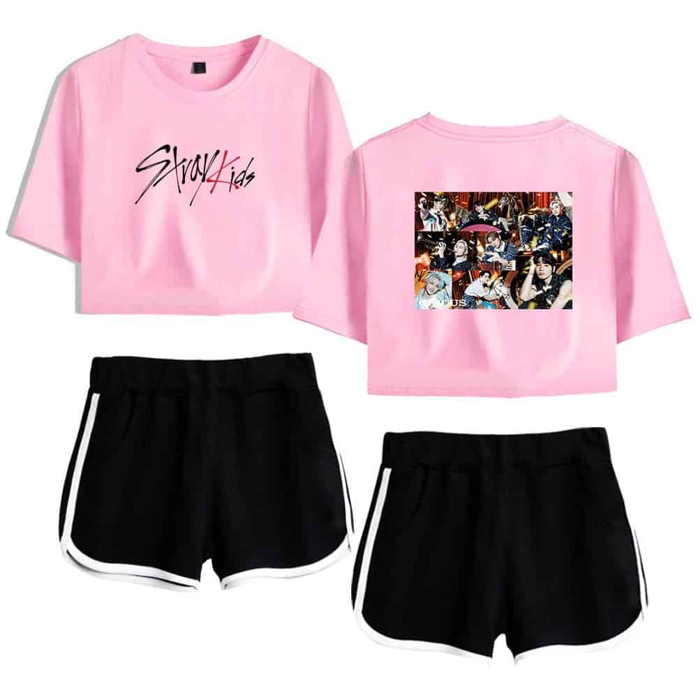Pink Justin Bieber swag merch crop top T-shirt with graphic design and black sporty shorts outfit.