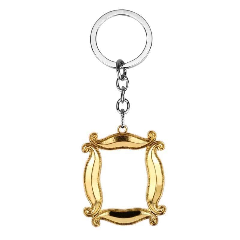 Keychain with gold and silver detailing, featuring a decorative frame design, inspired by Justin Bieber's swag merchandise.
