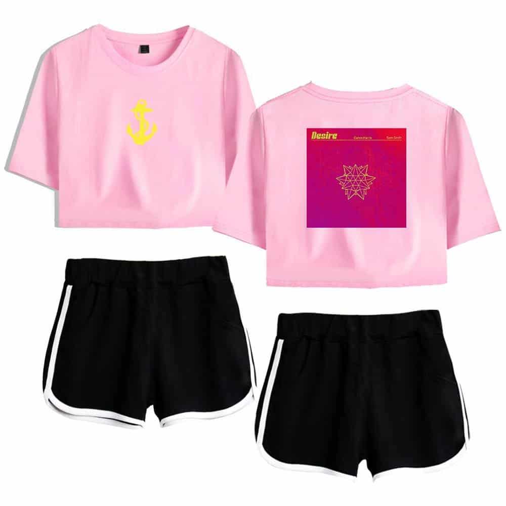 Pink crop top with a yellow anchor graphic, paired with black athletic shorts with white trim, inspired by Justin Bieber swag merchandise.