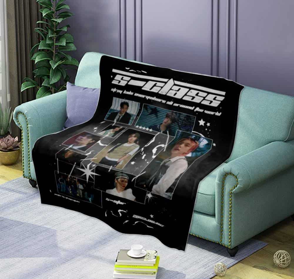 Justin Bieber swag merchandise blanket featuring images and designs of the pop icon.