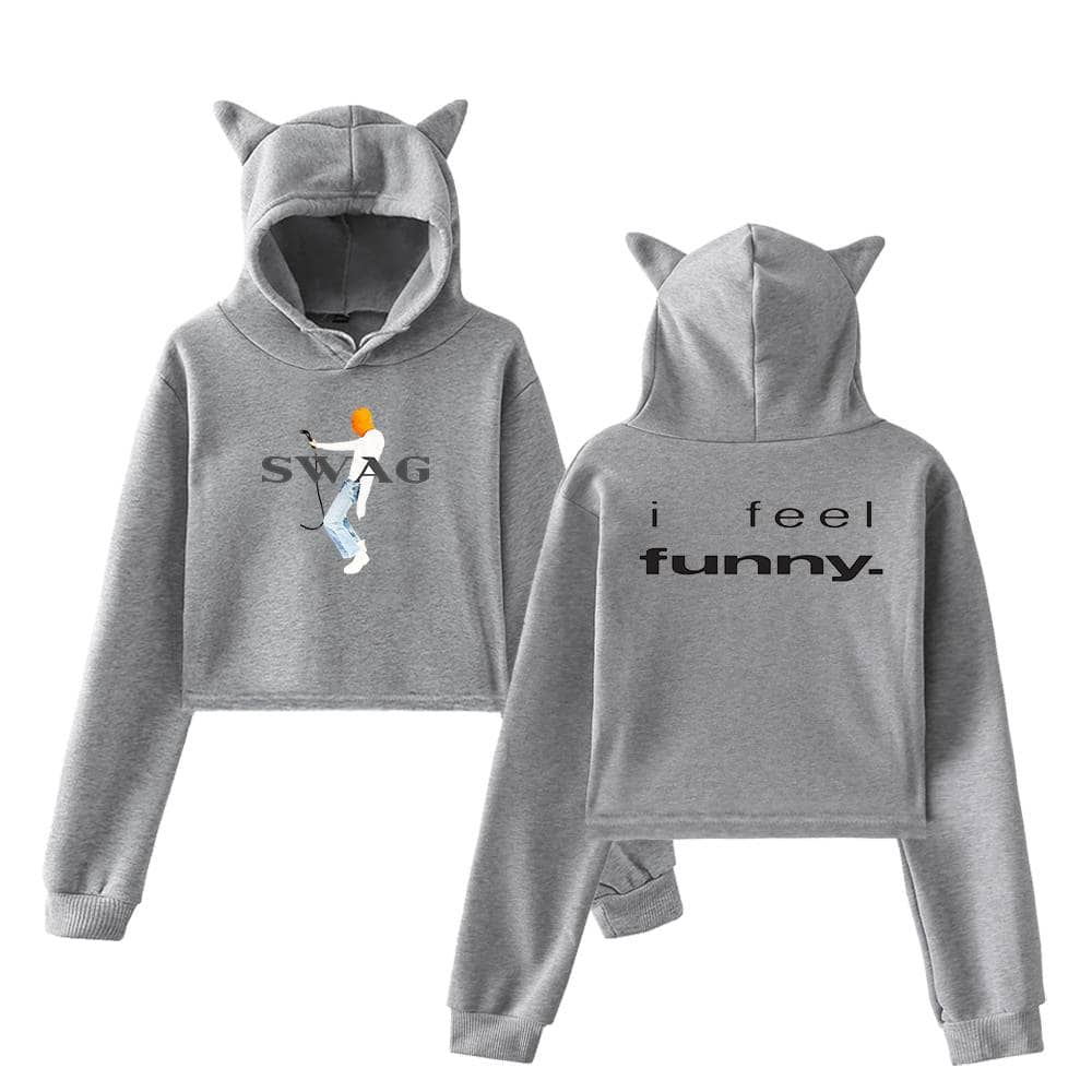 Sweatshirt with cartoon Justin Bieber holding a hockey stick, "SWAG" text, and matching hoodie with "i feel funny." text, both featuring cat ear hoods in gray color.
