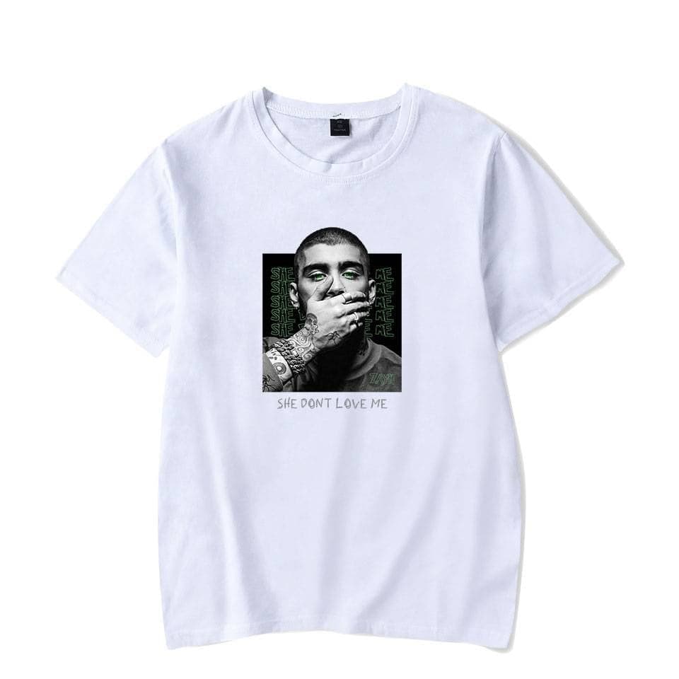 High-quality Justin Bieber swag merch T-shirt featuring a monochrome graphic of Bieber with hand over mouth and text "She Don't Love Me" on white fabric, perfect for fans of pop music and streetwear style.