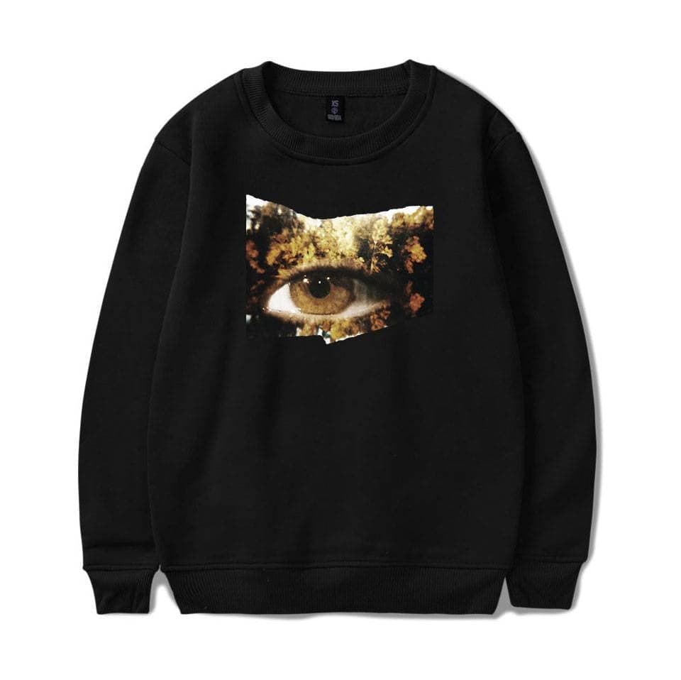 Eye-catching black sweatshirt featuring a creative artistic design with an eye and nature elements, perfect for Justin Bieber swag merch fans.