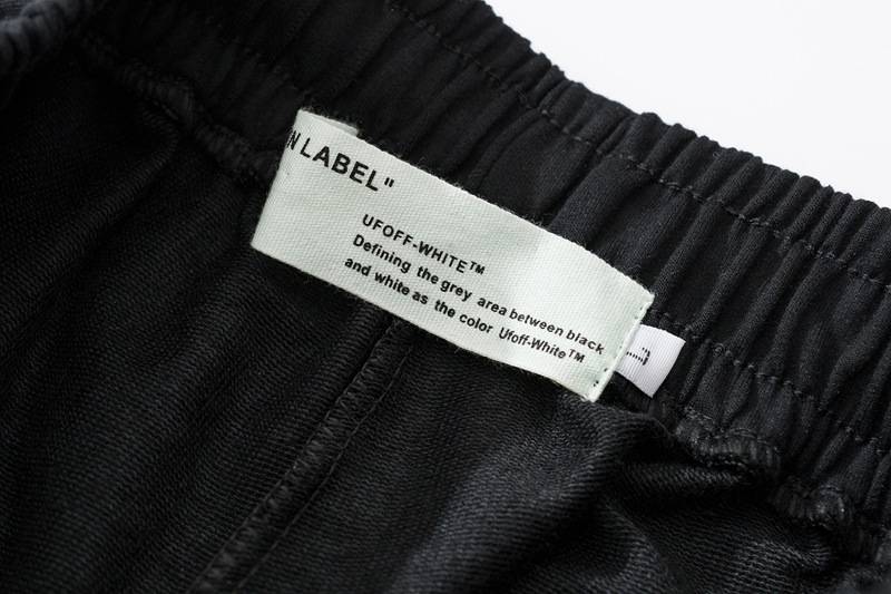 UFF WHITE clothing label showing color description.