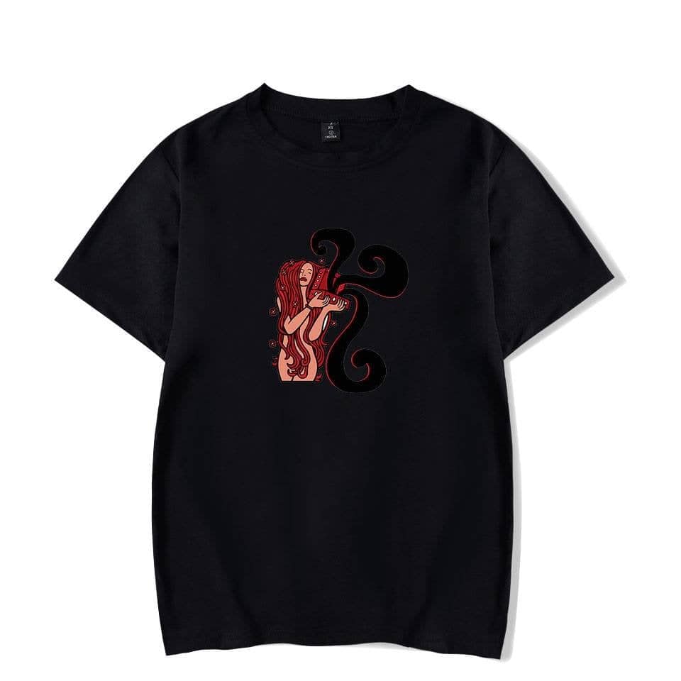A girl with long red hair playing the violin with black swirling designs on a black T-shirt.