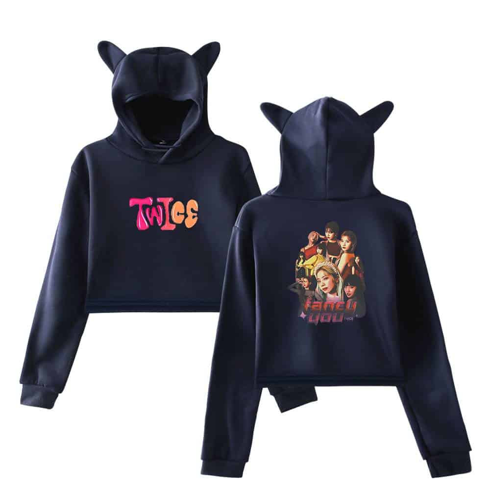 Bright navy blue hoodies featuring pop culture graphics, including one with "TWICE" logo and another with a colorful girl group illustration, designed for fans of K-pop and Justin Bieber swag merch.