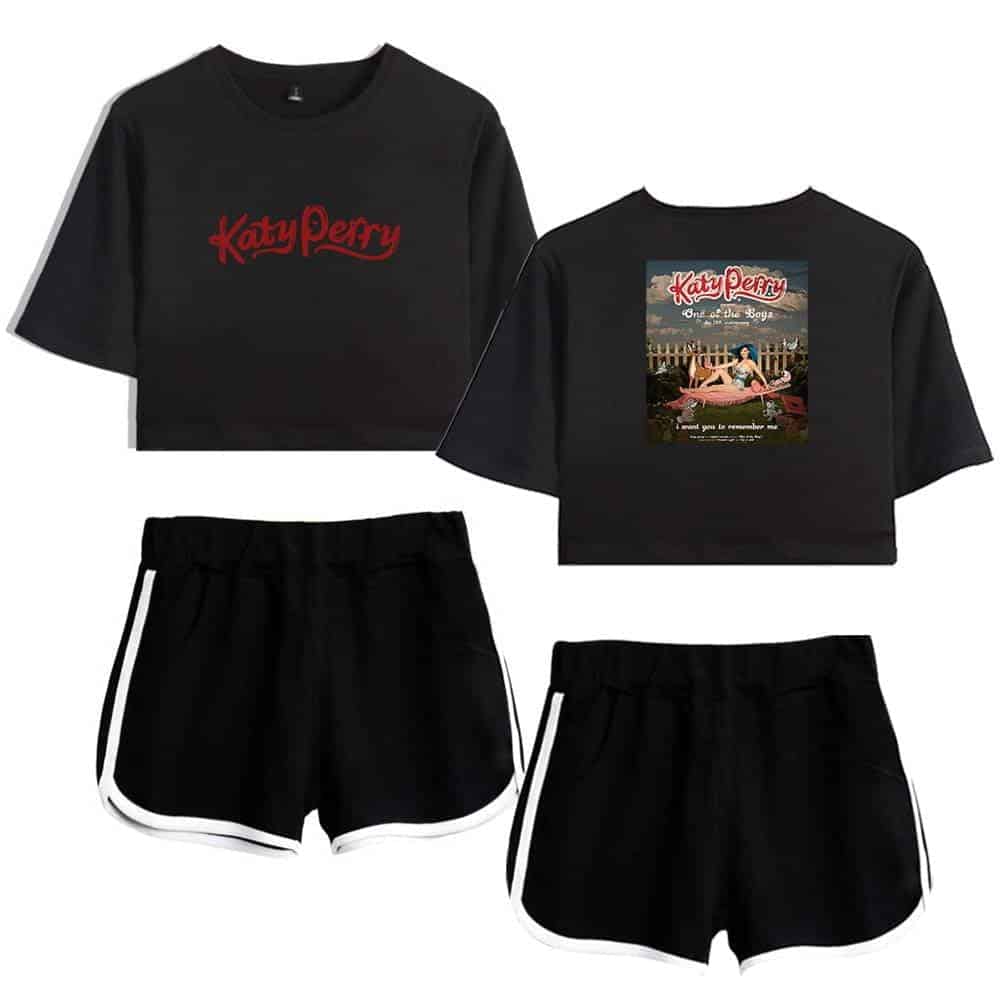 Katy Perry swag merch, black cropped t-shirts featuring her name and album cover art, paired with black shorts with white trim, ideal for fans seeking stylish music-themed apparel.