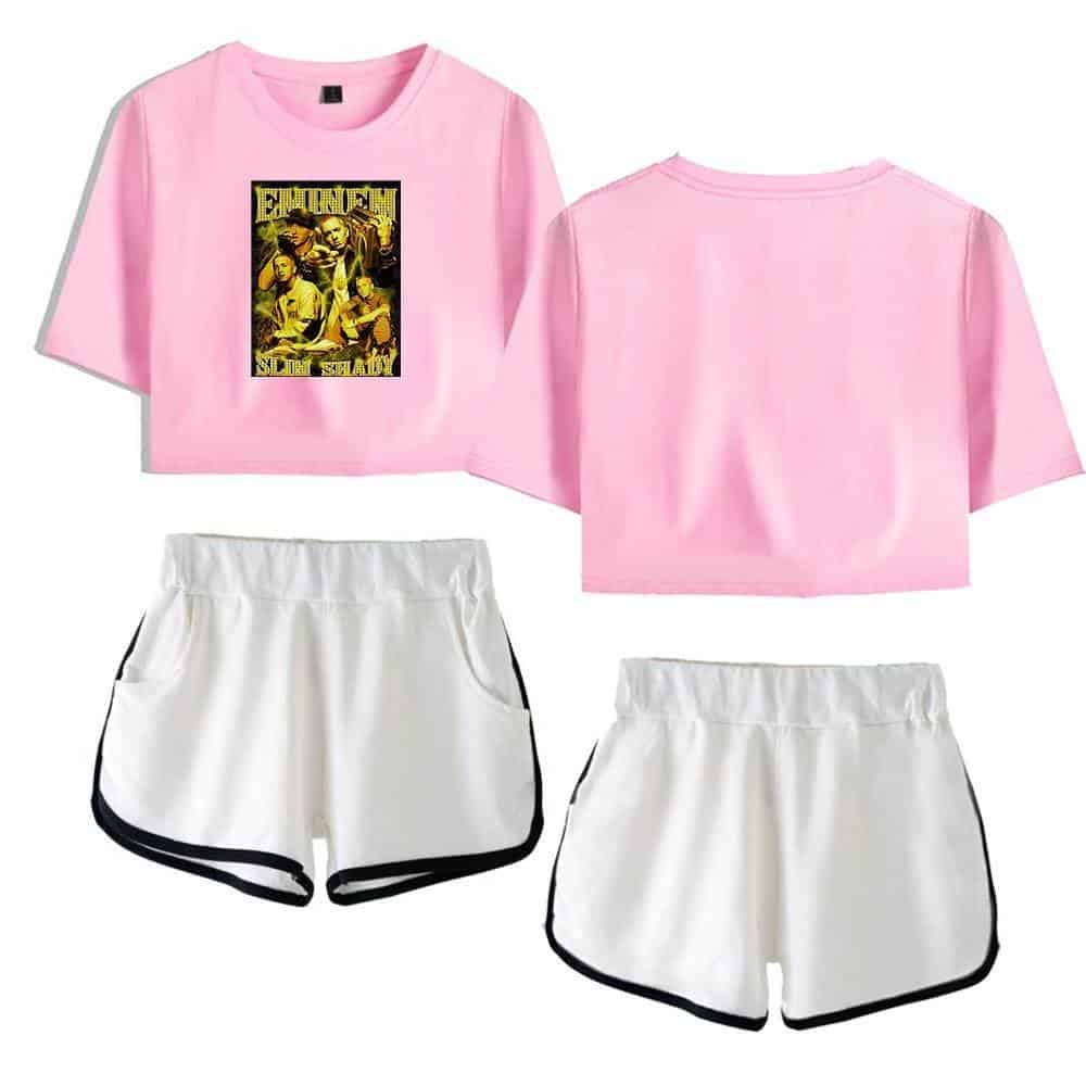 Justin Bieber swag merch pink cropped T-shirt with graphic print, casual sporty white shorts with black trim, trendy streetwear outfit, perfect for music fans and street style enthusiasts.