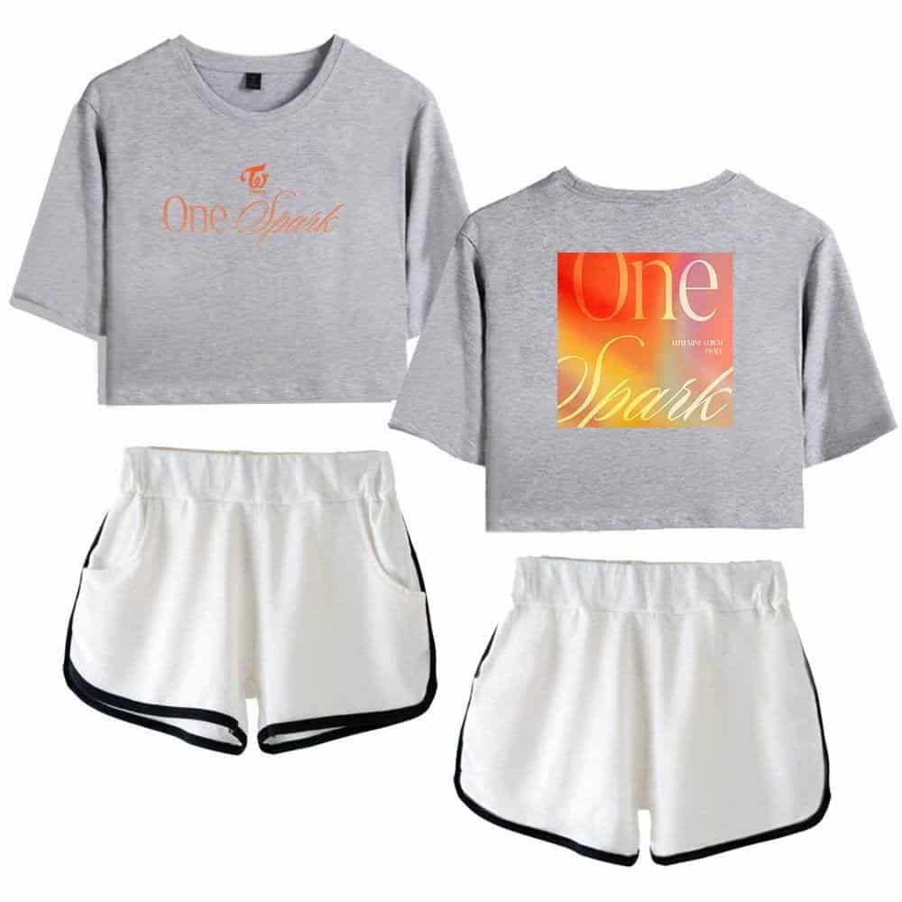 Justin Bieber swag merch set featuring grey crop tops with "One Spark" graphic and white athletic shorts with black trim. Perfect for fans looking to showcase their Bieber-inspired style.