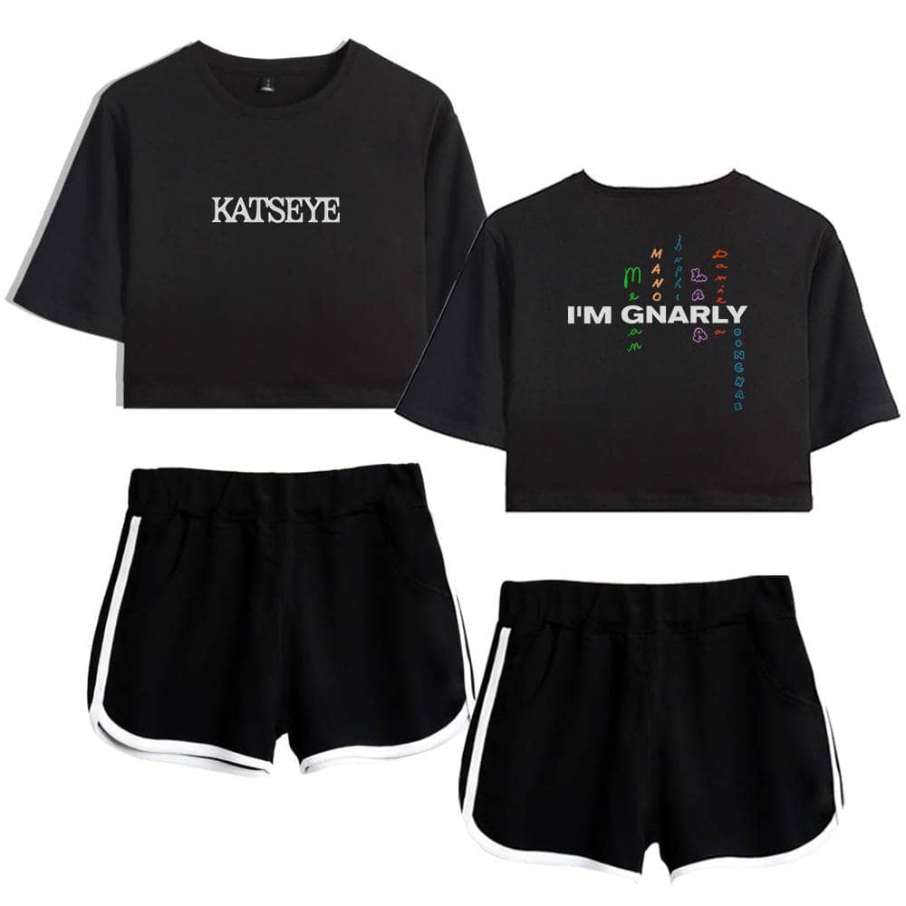 KATSEYE black crop top t-shirt and black athletic shorts with white trim, featuring bold text and colorful design elements inspired by Justin Bieber swag merch.