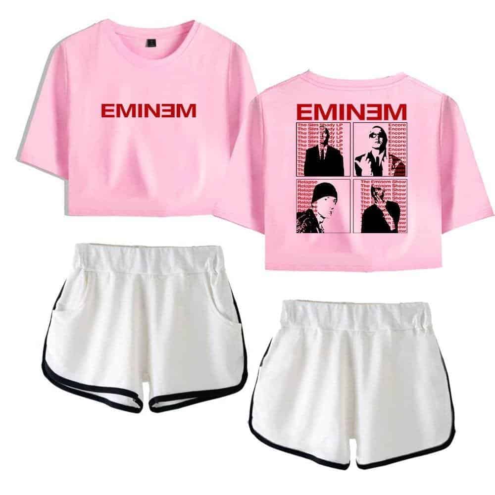 Justin Bieber swag merchandise featuring a pink Eminem-themed cropped T-shirt with graphic prints and sporty white shorts with black trim. Perfect for fans seeking stylish, trendy streetwear.