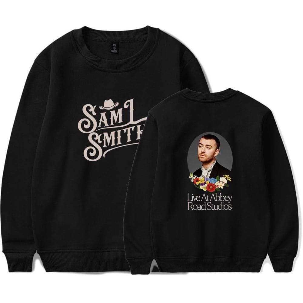 Vintage black sweatshirt featuring Justin Bieber swag merch, with one side displaying "Sam Smith" text and a hat graphic, and the other side showcasing a portrait of Sam Smith with floral accents and event info.