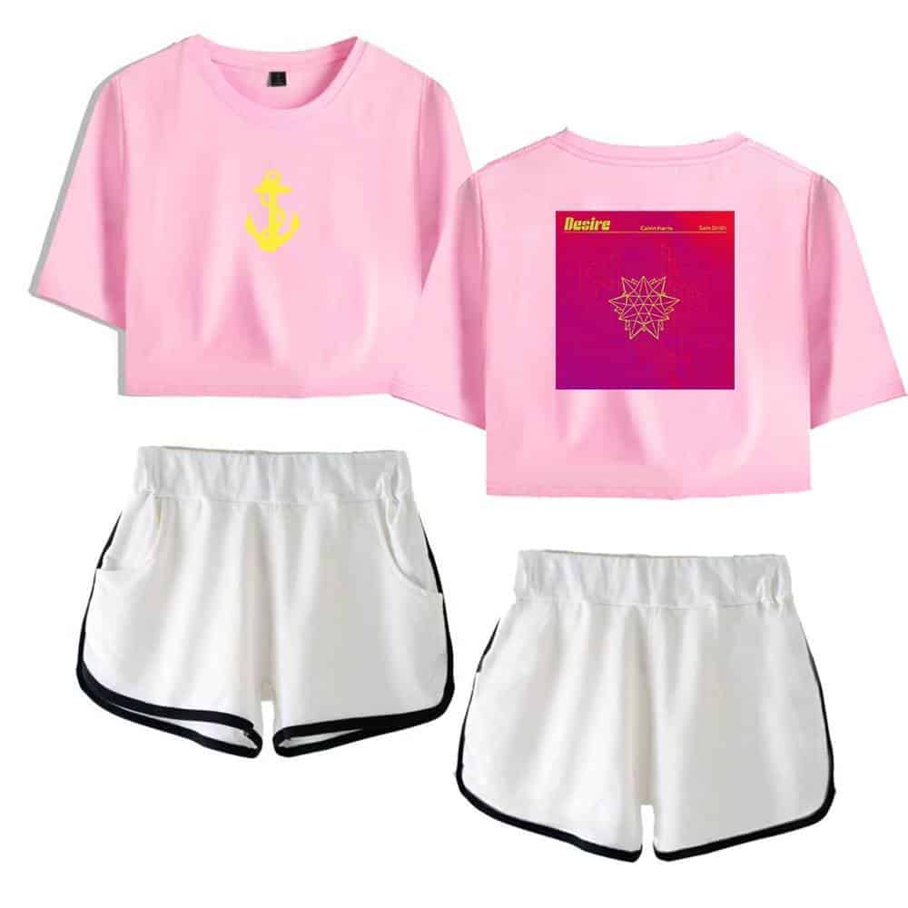 Justin bieber swag merch, pink crop top with yellow anchor graphic and graphic print on back, paired with white athletic shorts with black trim, trendy casual streetwear style, perfect for fans.