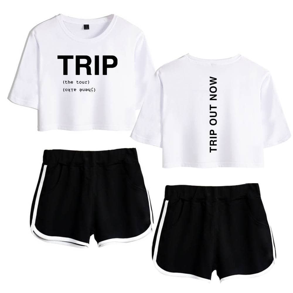 TRIP sweatshirt with bold black lettering, white cropped T-shirt with vertical text, sporty black shorts with white trim, stylish casual Justin Bieber swag merch set.