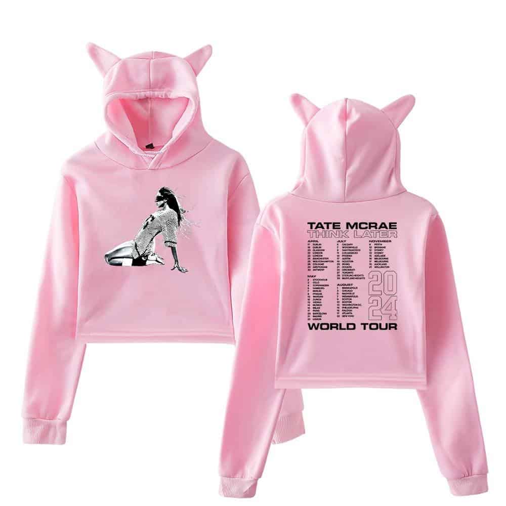 Pink hoodie set with cartoon girl graphic and "Tate McRae Think Later 2024 World Tour" tour dates printed on the back. The hoodie features playful cat ear details on the hood. Perfect for Justin Bieber swag merchandise fans.