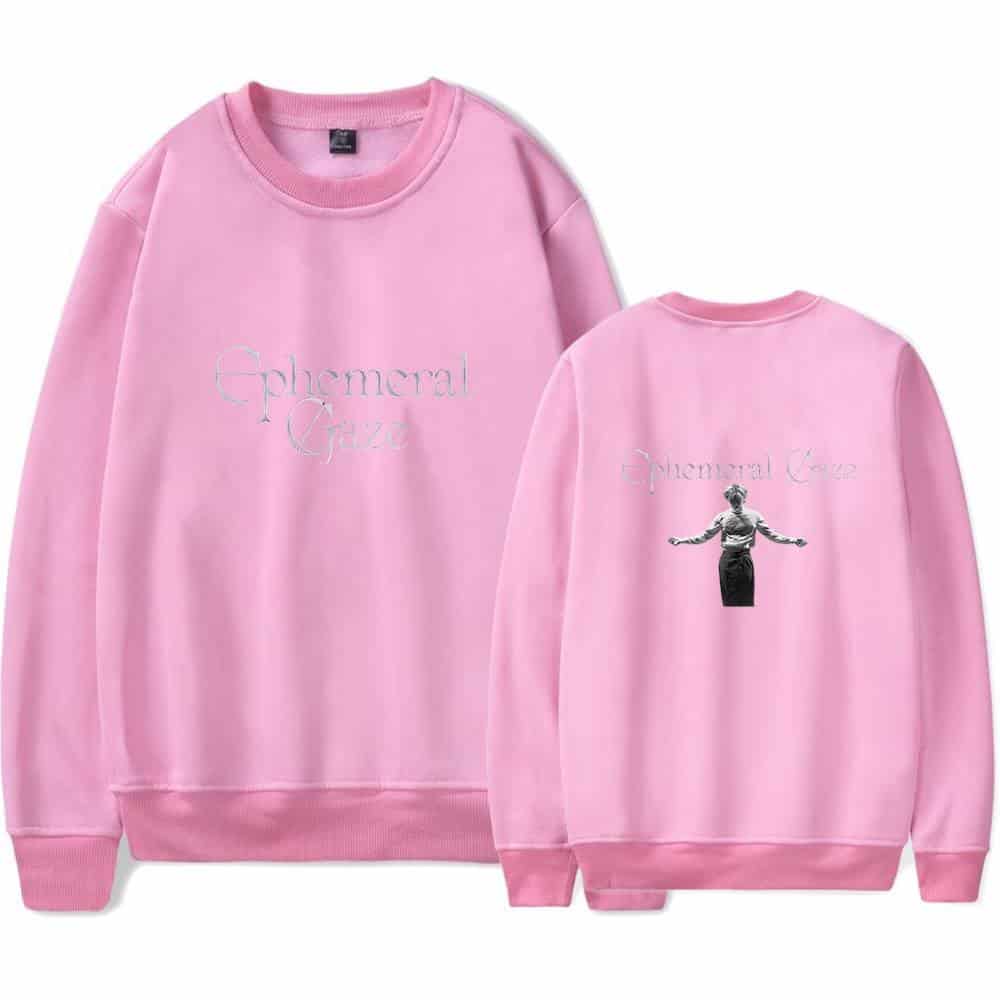Ethereal pink sweatshirt with "Ephemeral Craze" text and a black-and-white image of a person with arms outstretched on the back, stylish swag merch inspired by Justin Bieber's fashion line.