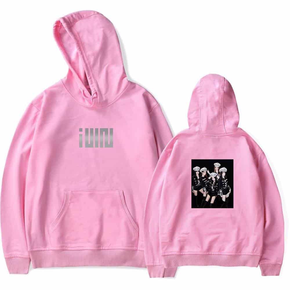 Pink hoodie with "iLOVE" text on front and a graphic of a girl group on the back, trendy Justin Bieber swag merchandise, streetwear style hoodie, celebrity-inspired fashion piece, stylish pullover for fans and streetwear enthusiasts.