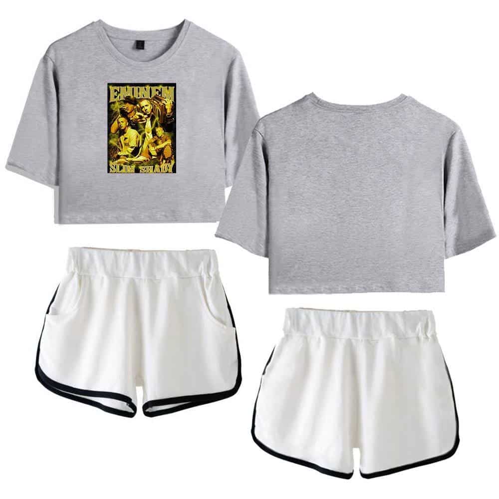 Grey cropped sweatshirt featuring a graphic print of a band, paired with white athletic shorts with black trim. Stylish casual wear inspired by Justin Bieber swag merch.