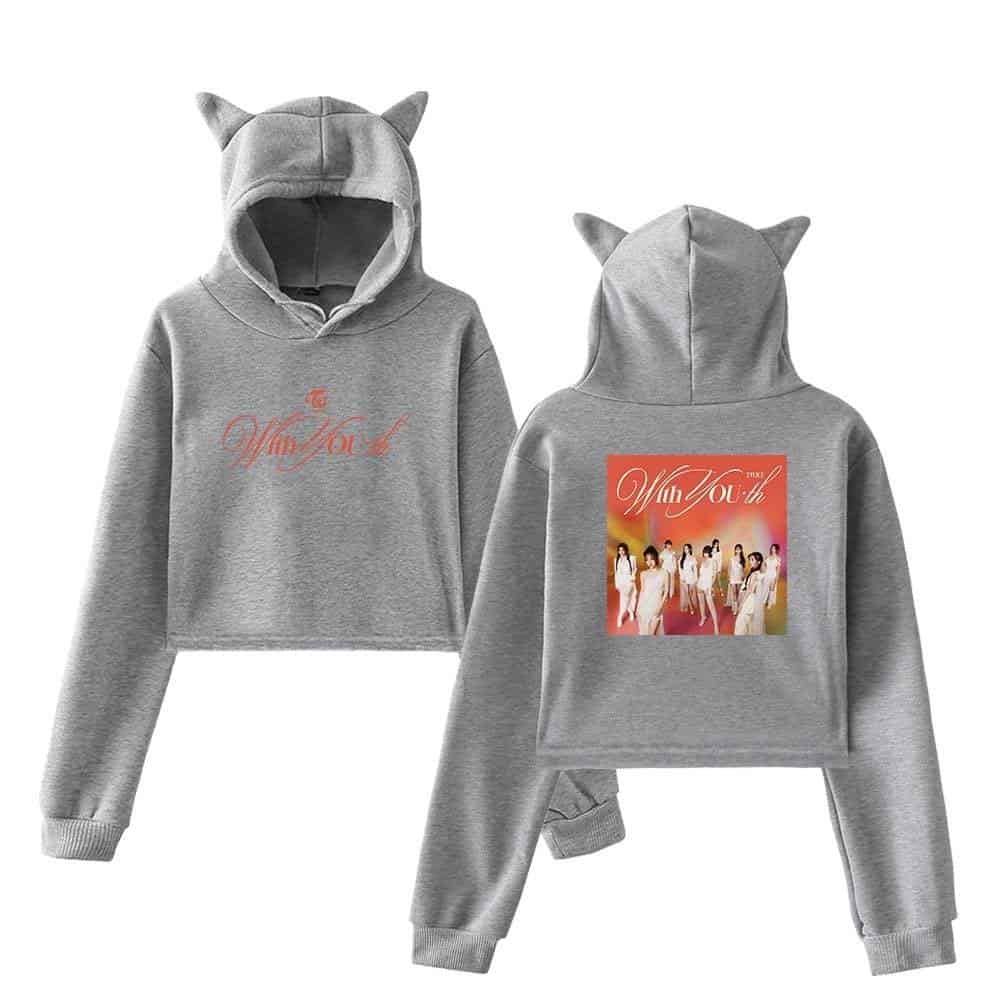 Whom you should think of as the model wearing a grey hoodie with cat ears, featuring "To Whom You" text on the front and a group photo on the back, representing Justin Bieber swag merch.