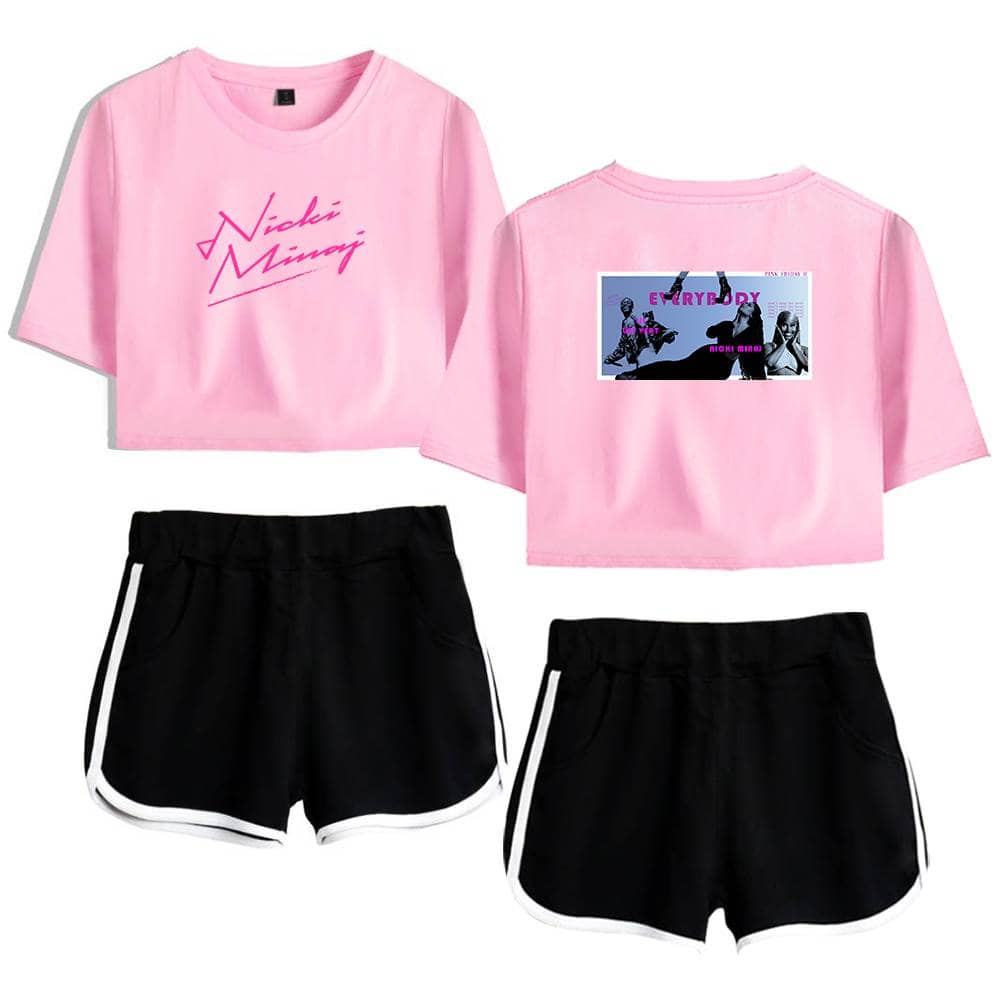 Pink crop top with "Nikki Minaj" graphic and back print featuring colorful artistic images of Nicki Minaj, paired with black athletic shorts with white trim, creating a sporty and trendy Justin Bieber swag merch look.