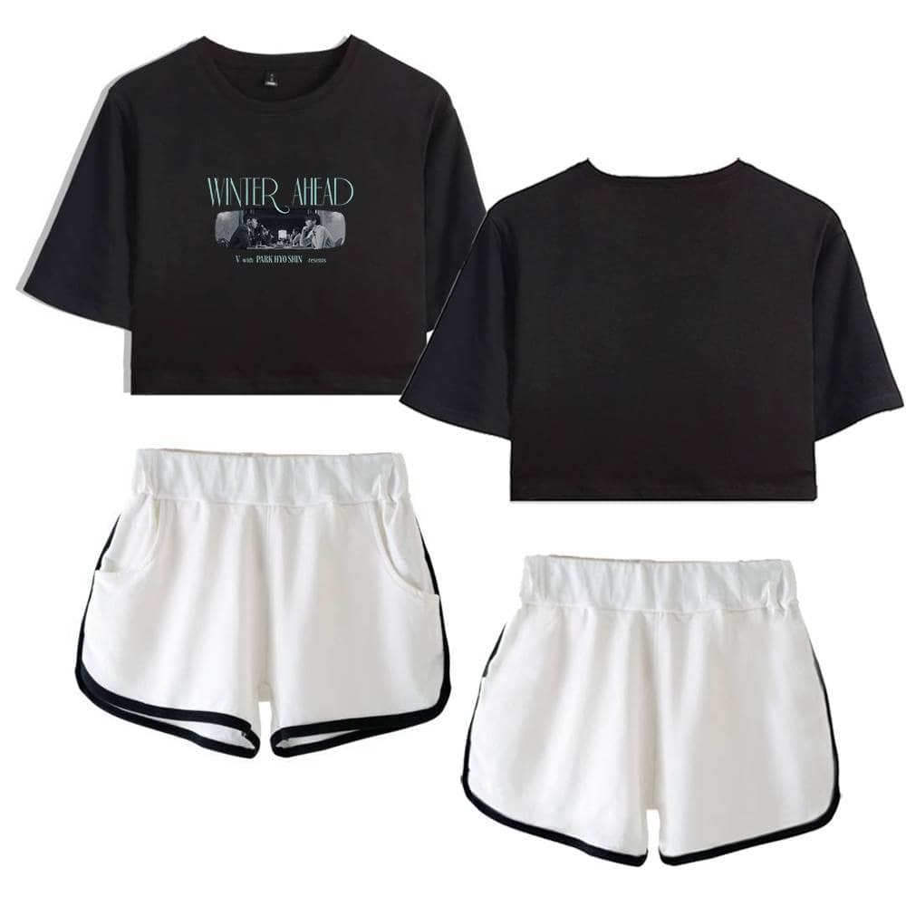 Black cropped graphic T-shirt with "Winter Ahead" print and pair of white athletic shorts with black trim, inspired by Justin Bieber swag merch style.