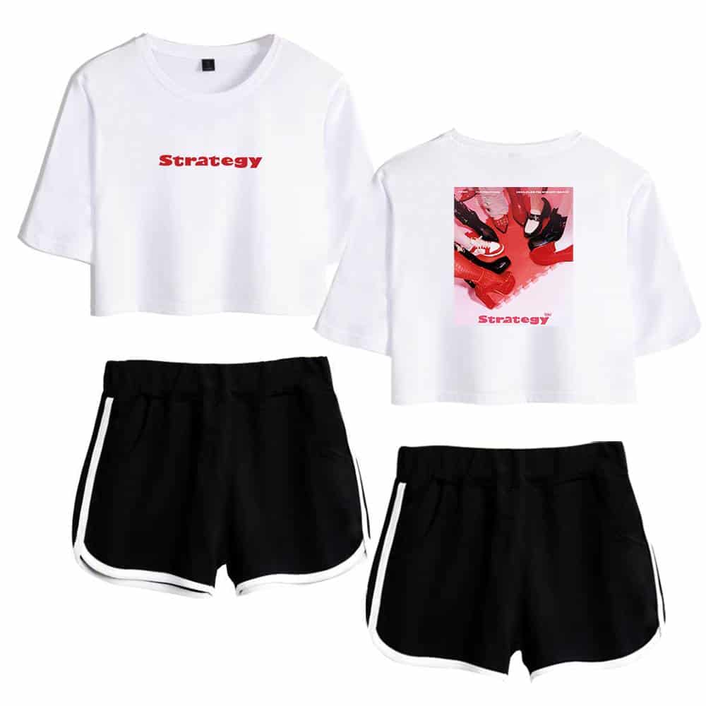White cropped t-shirt with red "Strategy" text, black athletic shorts with white stripes, casual streetwear for Justin Bieber fans.