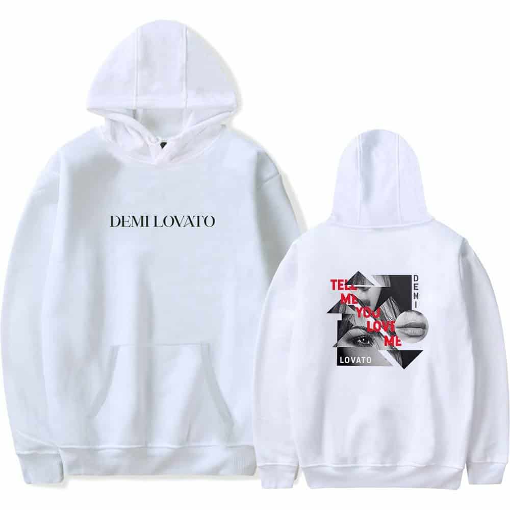White Demi Lovato graphic hoodie with bold text and artistic design elements. Perfect swag merch for fans. Stylish, comfortable, and trendy for streetwear looks.