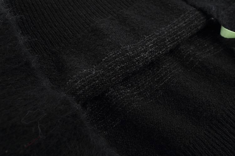 Justin Bieber swag merch black fabric detail showing material texture and stitching.