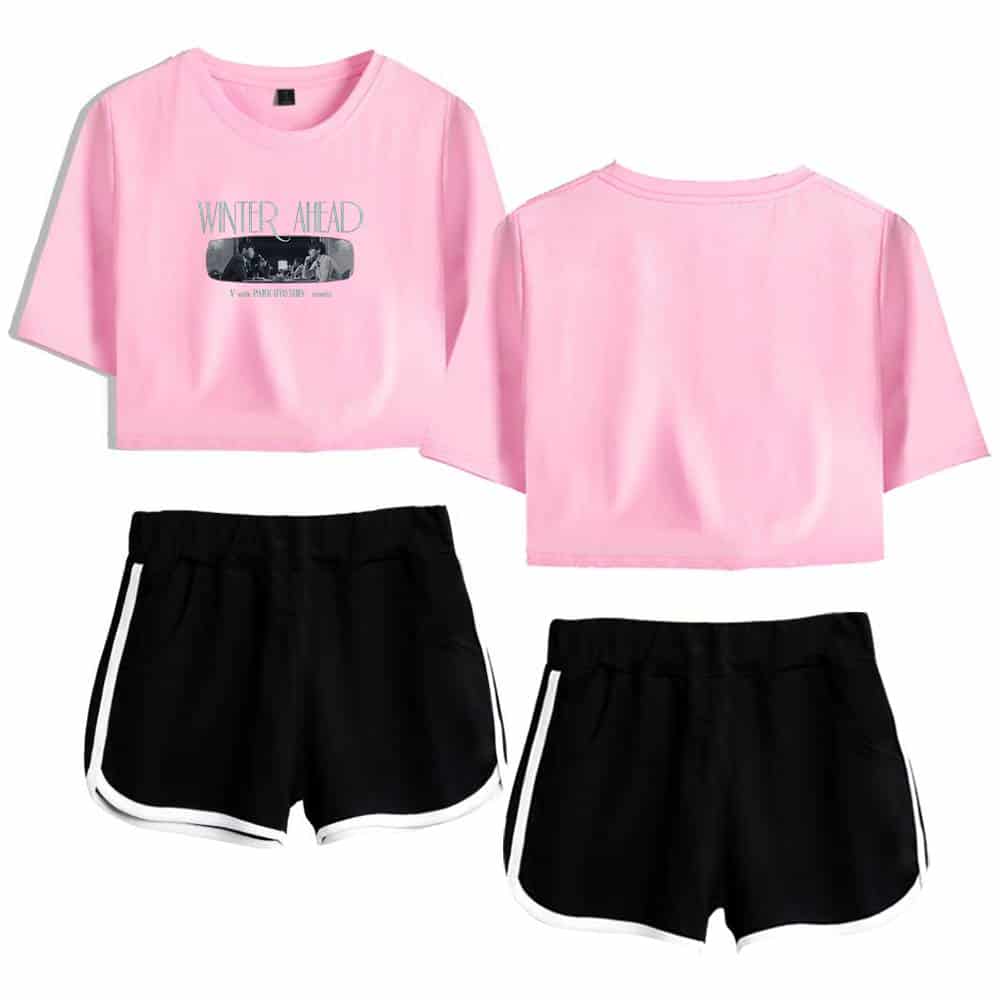 Pink Justin Bieber swag crop top t-shirt featuring "Winter Ahead" graphic and black athletic shorts with white trim. Perfect for casual streetwear or music fan merchandise.