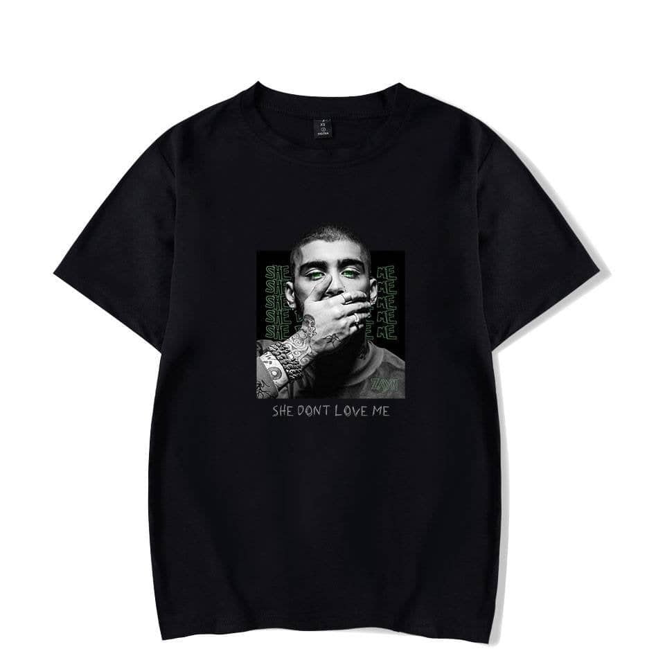 Justin Bieber swag T-shirt featuring a monochrome portrait with green eye accents and the phrase "SHE DON'T LOVE ME" printed below. Perfect for pop culture fans and streetwear enthusiasts.