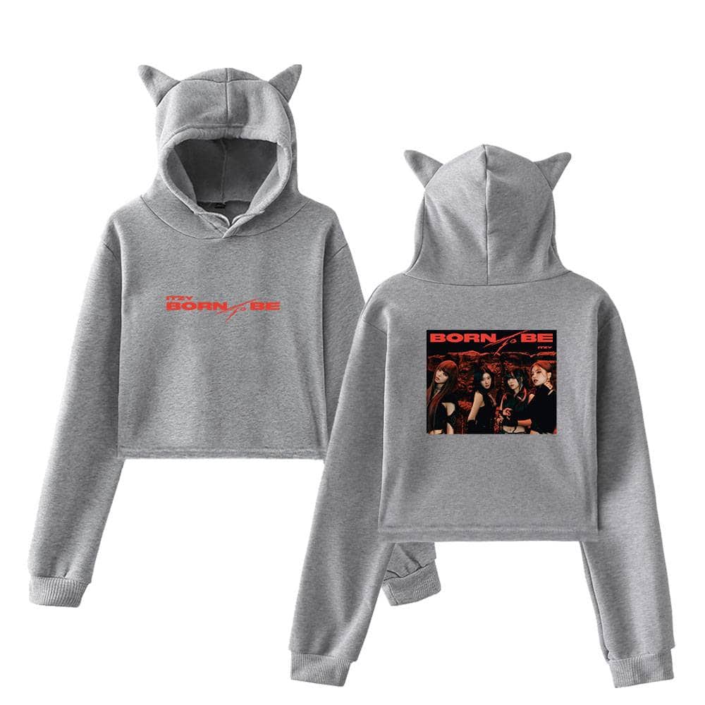 Grey hooded sweatshirt and sweatpants set inspired by Justin Bieber's swag merchandise, featuring cat ear details and bold "BORN TO BE" text with an image of a girl group on the back.