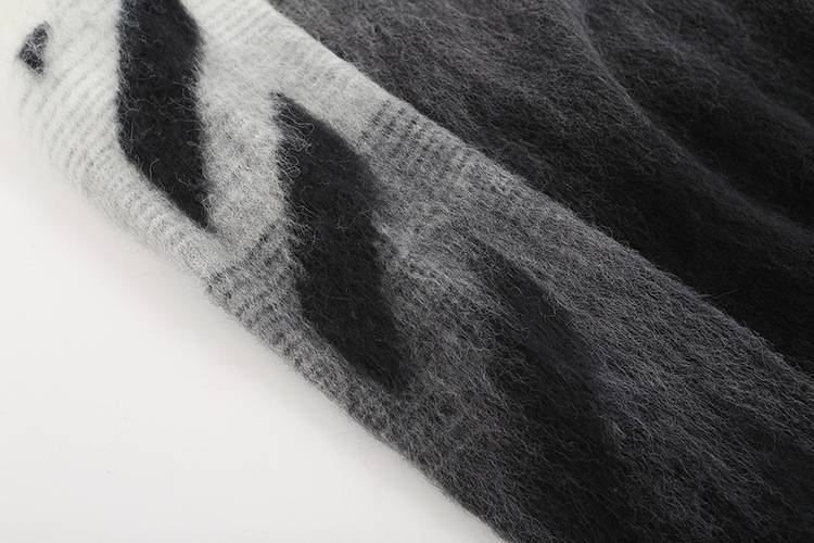 Justin bieber swag merch close-up of soft, fuzzy fabric with black and white design elements representing trendy streetwear style.