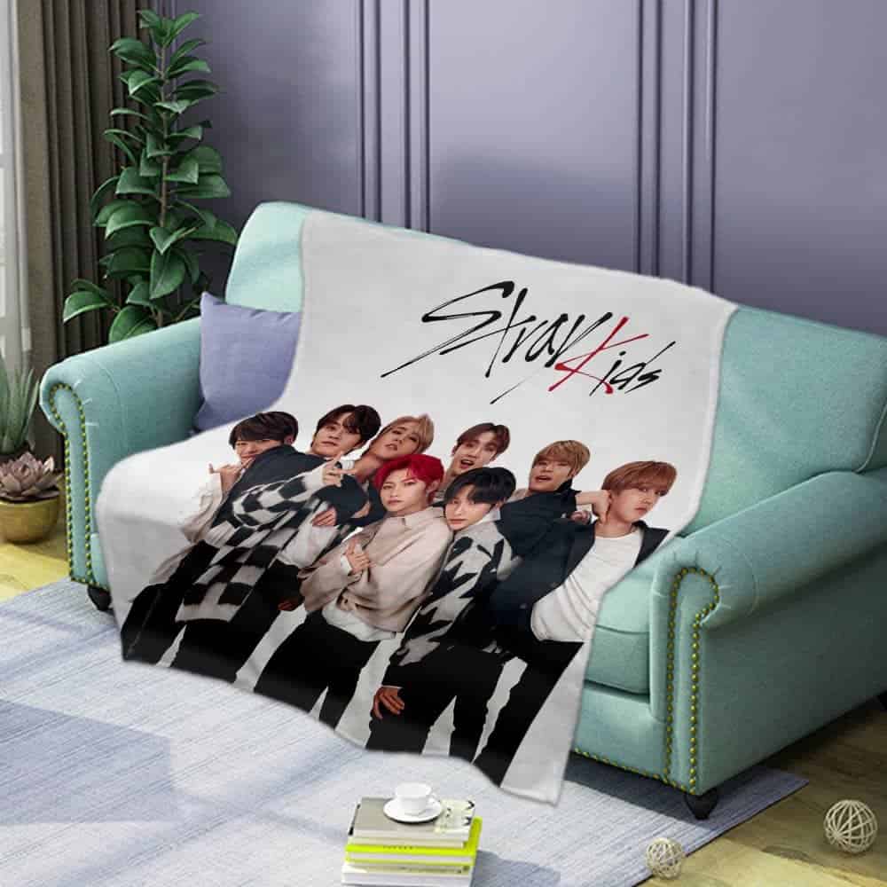 Justin Bieber swag merch blanket featuring the boy band Stray Kids in stylish black and white outfits. Perfect for fans to showcase their support and love for both artists in a cozy, fashionable way.