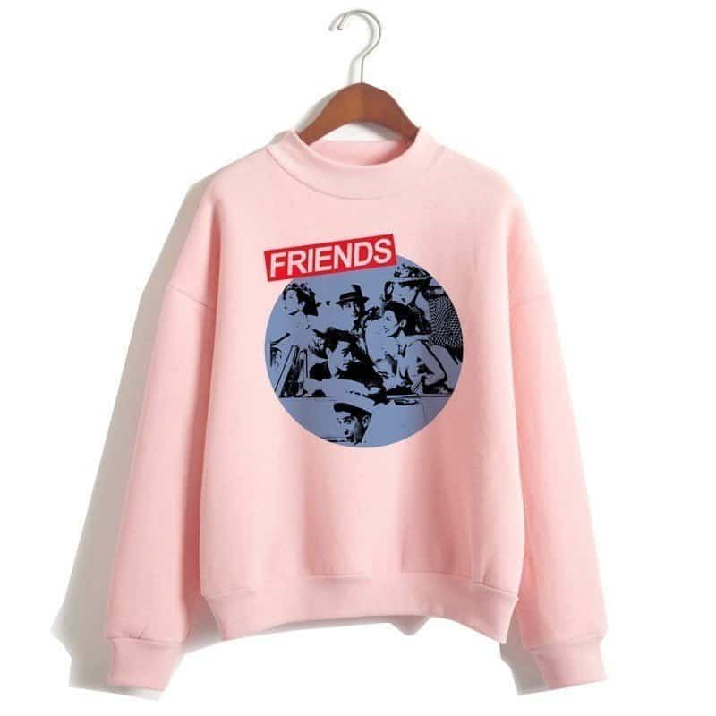 FRIENDS sweatshirt featuring iconic characters from the popular sitcom, in pink color with a bold graphic print. Perfect for fans of the show and trendy streetwear style.